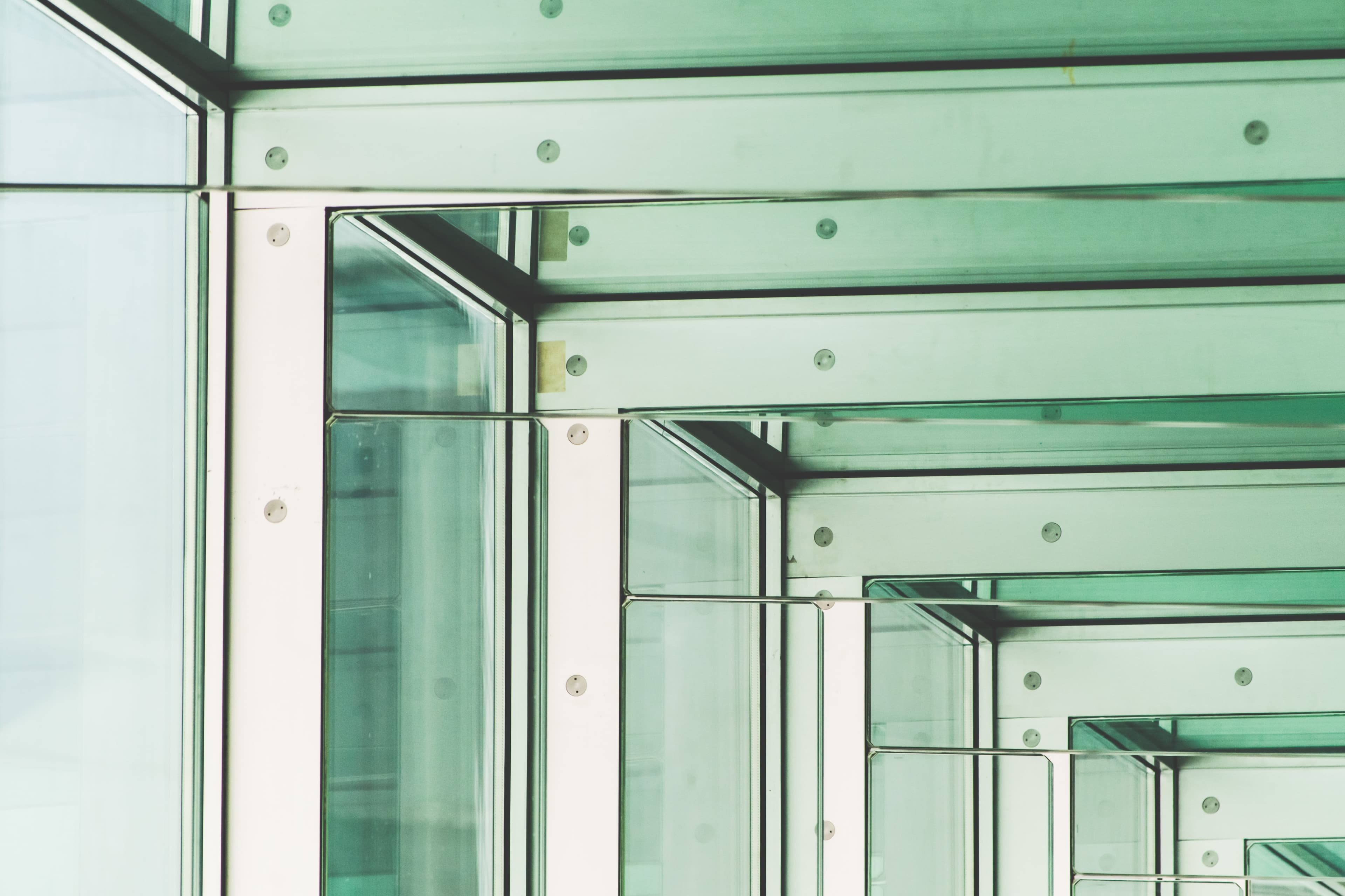repeating windows and their frames angled to make it appear that they are receding into the distance